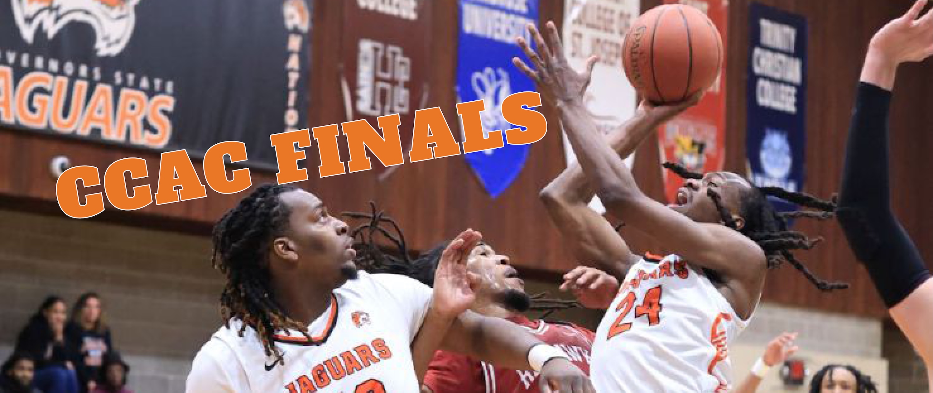 A group of men playing basketball